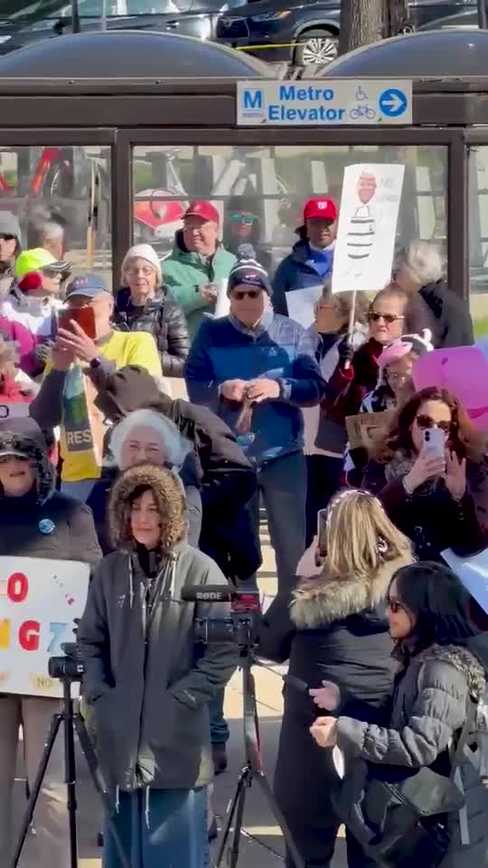 Protesters outside the Medical Center metro station in Bethesda. (Jack Kiyonaga for The Banner)