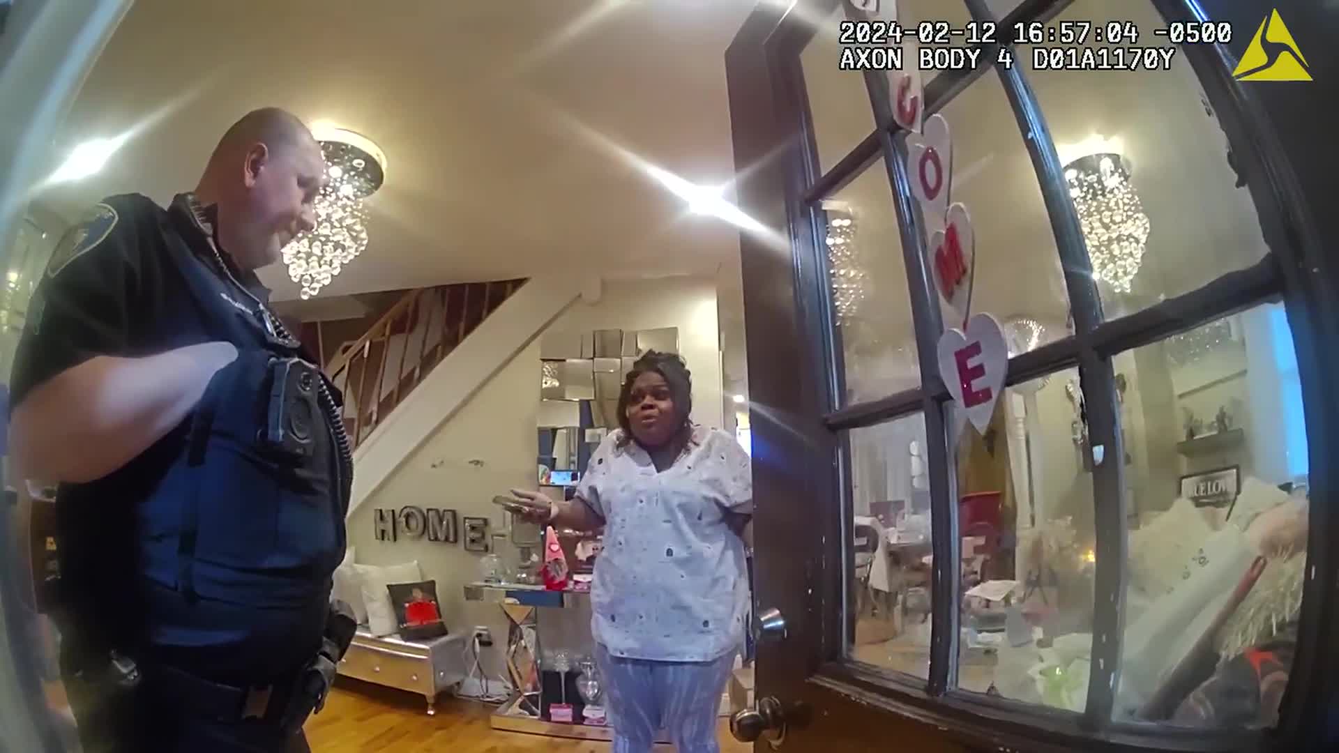 Police serve a warrant to Tahirah Williams 2 1/2 months after a disagreement with her neighbor.